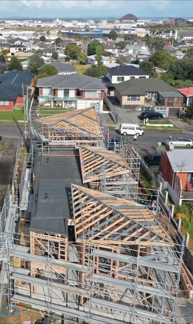 Aerial view of townhouse framing under construction in Auckland