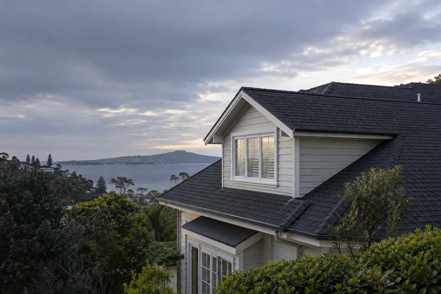 Completed charcoal asphalt shingle roof on an Auckland home