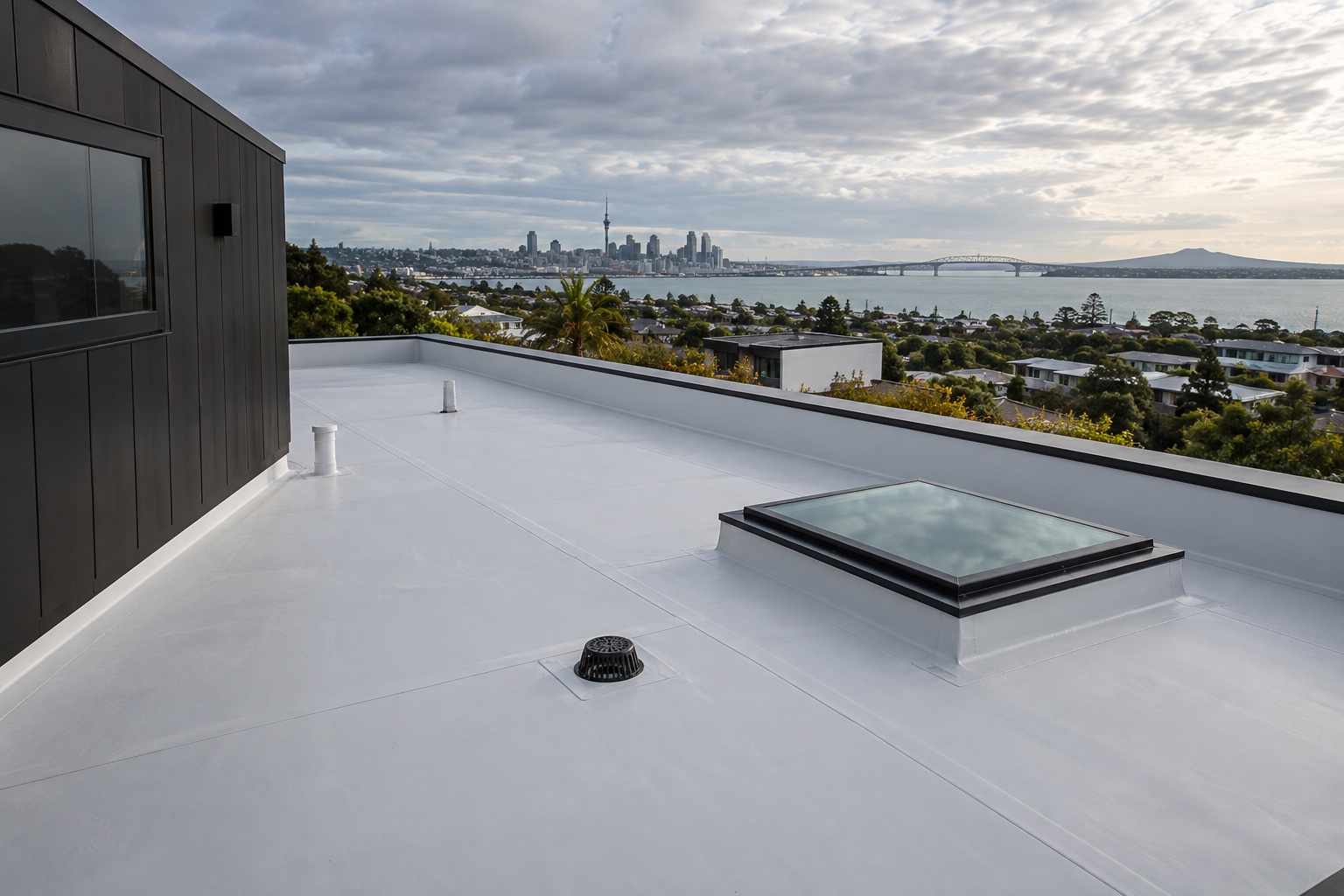 Completed TPO roof with welded seams and skylight in Auckland