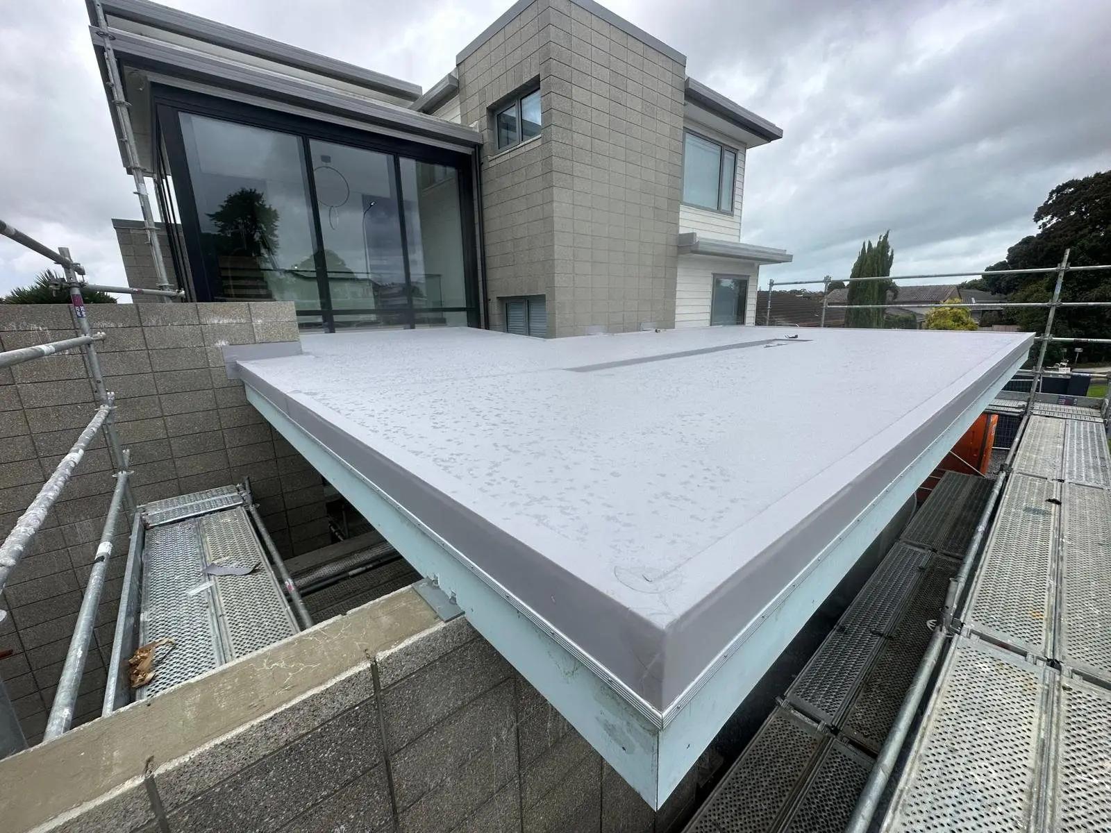 Waterproof membrane and parapet detailing on a modern Auckland home